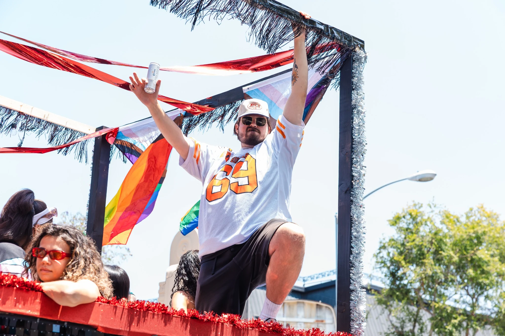 Matt Lockwood dancing on a colorful parade float
